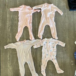4 pairs of Sweet Bamboo newborn 2-way zipper footies with handcuffs.
